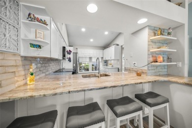 What a *WOW* when you walk into this beautifully updated villa on University Park Country Club in Florida - for sale on GolfHomes.com, golf home, golf lot