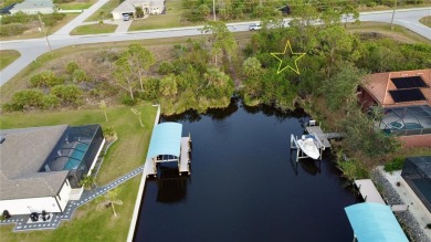 This exceptional WATERFRONT lot in South Gulf Cove offers direct on Rotonda Golf and Country Club - Long Marsh  in Florida - for sale on GolfHomes.com, golf home, golf lot