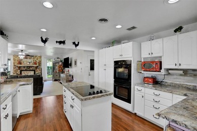 Welcome to this stunning home, where warmth and elegance await on The Grand Club - Pine Lakes Course in Florida - for sale on GolfHomes.com, golf home, golf lot