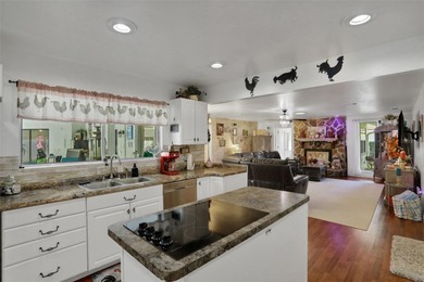 Welcome to this stunning home, where warmth and elegance await on The Grand Club - Pine Lakes Course in Florida - for sale on GolfHomes.com, golf home, golf lot