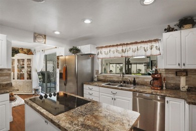 Welcome to this stunning home, where warmth and elegance await on The Grand Club - Pine Lakes Course in Florida - for sale on GolfHomes.com, golf home, golf lot