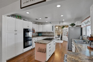 Welcome to this stunning home, where warmth and elegance await on The Grand Club - Pine Lakes Course in Florida - for sale on GolfHomes.com, golf home, golf lot