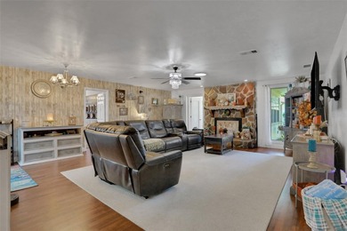 Welcome to this stunning home, where warmth and elegance await on The Grand Club - Pine Lakes Course in Florida - for sale on GolfHomes.com, golf home, golf lot