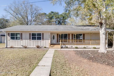 Welcome to this fully renovated, move-in ready ranch home in on Diamondhead Country Club in Mississippi - for sale on GolfHomes.com, golf home, golf lot