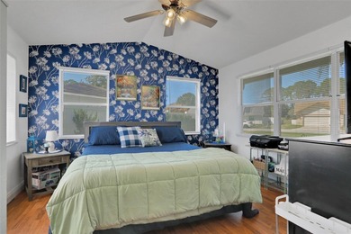 Welcome to this stunning home, where warmth and elegance await on The Grand Club - Pine Lakes Course in Florida - for sale on GolfHomes.com, golf home, golf lot