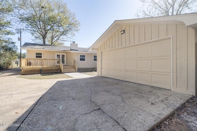 Welcome to this fully renovated, move-in ready ranch home in on Diamondhead Country Club in Mississippi - for sale on GolfHomes.com, golf home, golf lot
