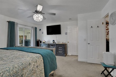 Welcome to this stunning home, where warmth and elegance await on The Grand Club - Pine Lakes Course in Florida - for sale on GolfHomes.com, golf home, golf lot