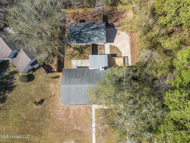 Welcome to this fully renovated, move-in ready ranch home in on Diamondhead Country Club in Mississippi - for sale on GolfHomes.com, golf home, golf lot