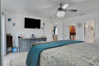 Welcome to this stunning home, where warmth and elegance await on The Grand Club - Pine Lakes Course in Florida - for sale on GolfHomes.com, golf home, golf lot