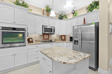 Under contract-accepting backup offers. Experience luxury living on Bella Glade Country Club in Florida - for sale on GolfHomes.com, golf home, golf lot