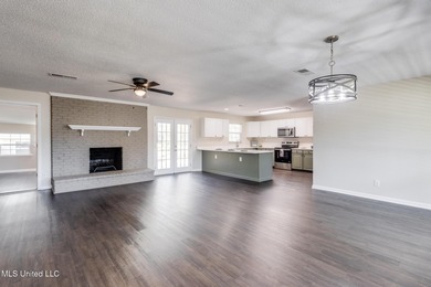 Welcome to this fully renovated, move-in ready ranch home in on Diamondhead Country Club in Mississippi - for sale on GolfHomes.com, golf home, golf lot