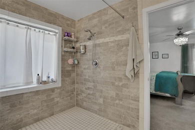 Welcome to this stunning home, where warmth and elegance await on The Grand Club - Pine Lakes Course in Florida - for sale on GolfHomes.com, golf home, golf lot