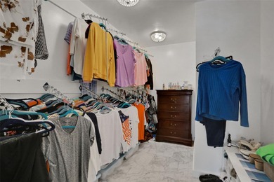 Welcome to this stunning home, where warmth and elegance await on The Grand Club - Pine Lakes Course in Florida - for sale on GolfHomes.com, golf home, golf lot