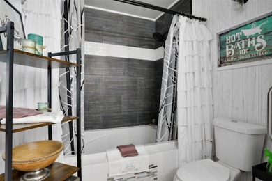 Welcome to this stunning home, where warmth and elegance await on The Grand Club - Pine Lakes Course in Florida - for sale on GolfHomes.com, golf home, golf lot