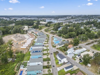 Gorgeous raised beach house near the Cherry Grove section of on Tidewater Golf Club and Plantation in South Carolina - for sale on GolfHomes.com, golf home, golf lot