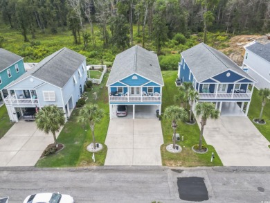 Gorgeous raised beach house near the Cherry Grove section of on Tidewater Golf Club and Plantation in South Carolina - for sale on GolfHomes.com, golf home, golf lot
