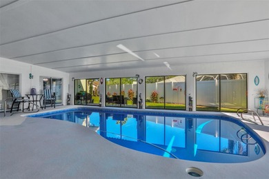 Welcome to this stunning home, where warmth and elegance await on The Grand Club - Pine Lakes Course in Florida - for sale on GolfHomes.com, golf home, golf lot