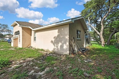 Located in Spring Hill, Hernando County, 6121 Piedmont Dr sits on Oak Hills Country Club in Florida - for sale on GolfHomes.com, golf home, golf lot