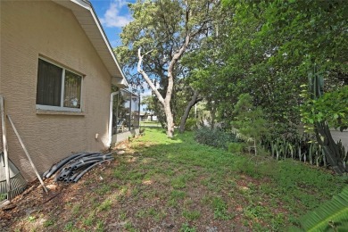 Located in Spring Hill, Hernando County, 6121 Piedmont Dr sits on Oak Hills Country Club in Florida - for sale on GolfHomes.com, golf home, golf lot