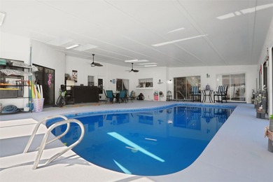 Welcome to this stunning home, where warmth and elegance await on The Grand Club - Pine Lakes Course in Florida - for sale on GolfHomes.com, golf home, golf lot