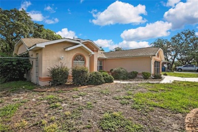 Located in Spring Hill, Hernando County, 6121 Piedmont Dr sits on Oak Hills Country Club in Florida - for sale on GolfHomes.com, golf home, golf lot