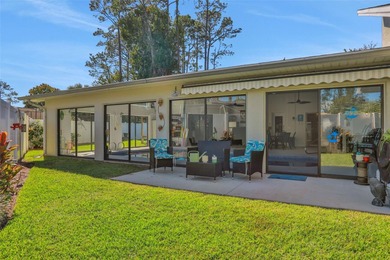 Welcome to this stunning home, where warmth and elegance await on The Grand Club - Pine Lakes Course in Florida - for sale on GolfHomes.com, golf home, golf lot