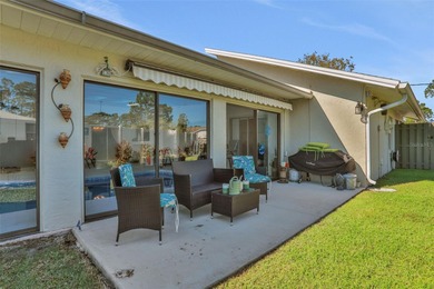 Welcome to this stunning home, where warmth and elegance await on The Grand Club - Pine Lakes Course in Florida - for sale on GolfHomes.com, golf home, golf lot