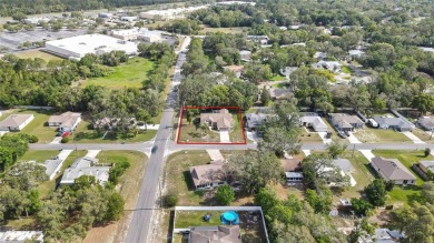 Located in Spring Hill, Hernando County, 6121 Piedmont Dr sits on Oak Hills Country Club in Florida - for sale on GolfHomes.com, golf home, golf lot