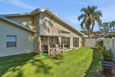 Welcome to this stunning home, where warmth and elegance await on The Grand Club - Pine Lakes Course in Florida - for sale on GolfHomes.com, golf home, golf lot