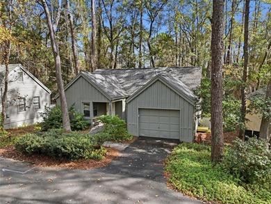 Nestled on a beautiful wooded lot in the Founders Hill on Haile Plantation Golf and Country Club in Florida - for sale on GolfHomes.com, golf home, golf lot