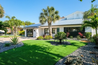 Secluded within the exclusive Boca Ciega Isle neighborhood, this on Isla Del Sol Yacht and Country Club in Florida - for sale on GolfHomes.com, golf home, golf lot