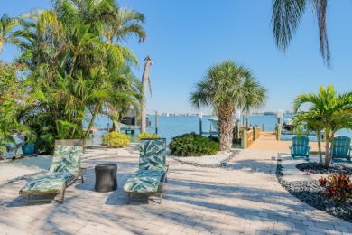 Secluded within the exclusive Boca Ciega Isle neighborhood, this on Isla Del Sol Yacht and Country Club in Florida - for sale on GolfHomes.com, golf home, golf lot