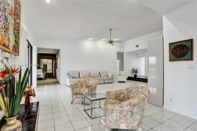 Step into this beautiful 3-bed, 2-bath home in Woodmont's on Woodmont Country Club in Florida - for sale on GolfHomes.com, golf home, golf lot