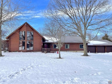 Opportunity awaits! Gorgeous log home living on a quiet street on Lake Perry Country Club in Kansas - for sale on GolfHomes.com, golf home, golf lot