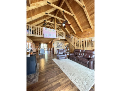 Opportunity awaits! Gorgeous log home living on a quiet street on Lake Perry Country Club in Kansas - for sale on GolfHomes.com, golf home, golf lot