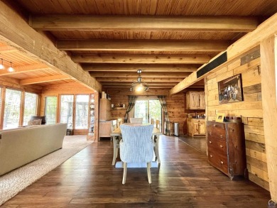 Opportunity awaits! Gorgeous log home living on a quiet street on Lake Perry Country Club in Kansas - for sale on GolfHomes.com, golf home, golf lot