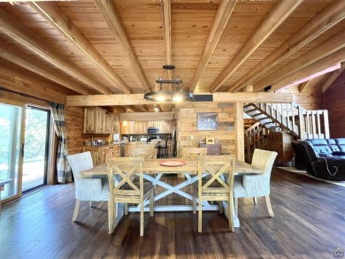 Opportunity awaits! Gorgeous log home living on a quiet street on Lake Perry Country Club in Kansas - for sale on GolfHomes.com, golf home, golf lot