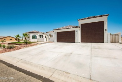Located at 6322 S Via De Oro, Fort Mohave, Arizona, this on Los Lagos Golf Club in Arizona - for sale on GolfHomes.com, golf home, golf lot