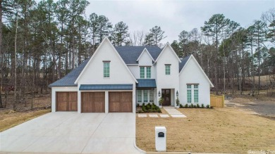This is a beautiful, custom build that backs up to greenery with on Chenal Country Club - Bear Den Mountain in Arkansas - for sale on GolfHomes.com, golf home, golf lot