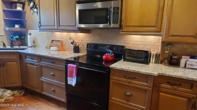 Lovely updated golf front condo is available in Foxfire Village on Foxfire Golf and Country Club in North Carolina - for sale on GolfHomes.com, golf home, golf lot