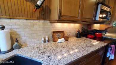 Lovely updated golf front condo is available in Foxfire Village on Foxfire Golf and Country Club in North Carolina - for sale on GolfHomes.com, golf home, golf lot