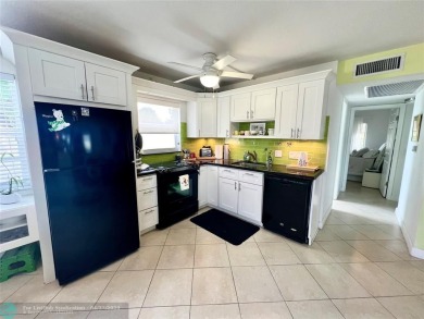 Welcome to this charming first-floor corner condo, lovingly on Hillsboro Pines Golf in Florida - for sale on GolfHomes.com, golf home, golf lot