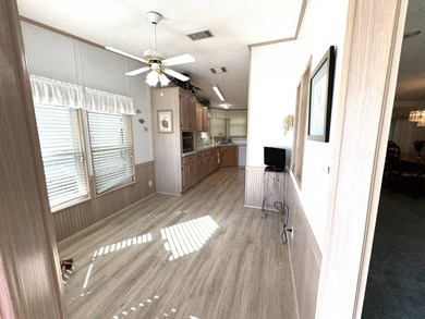 Discover this well maintained manufactured home located in the on Schalamar Creek Golf and Country Club in Florida - for sale on GolfHomes.com, golf home, golf lot