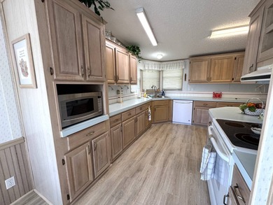 Discover this well maintained manufactured home located in the on Schalamar Creek Golf and Country Club in Florida - for sale on GolfHomes.com, golf home, golf lot