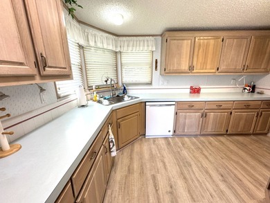 Discover this well maintained manufactured home located in the on Schalamar Creek Golf and Country Club in Florida - for sale on GolfHomes.com, golf home, golf lot