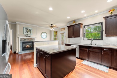 Welcome home to this stunning 5-bedroom, 3.5-bathroom gem on Traditions of Braselton Golf Club in Georgia - for sale on GolfHomes.com, golf home, golf lot