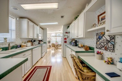 This beautiful two-bedroom, two-bath plus den home is located in on Pine Lakes Country Club in Florida - for sale on GolfHomes.com, golf home, golf lot