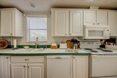 This beautiful two-bedroom, two-bath plus den home is located in on Pine Lakes Country Club in Florida - for sale on GolfHomes.com, golf home, golf lot