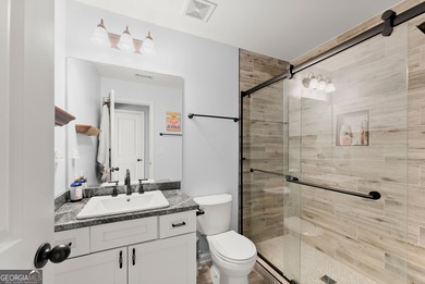 Welcome home to this stunning 5-bedroom, 3.5-bathroom gem on Traditions of Braselton Golf Club in Georgia - for sale on GolfHomes.com, golf home, golf lot