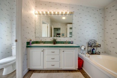 This beautiful two-bedroom, two-bath plus den home is located in on Pine Lakes Country Club in Florida - for sale on GolfHomes.com, golf home, golf lot